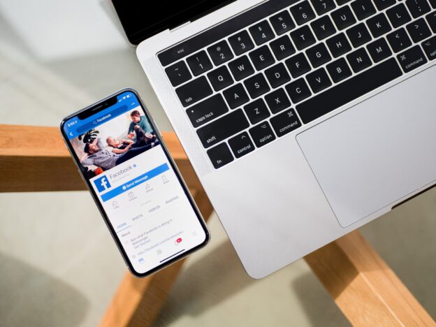 A laptop and a phone on a desk